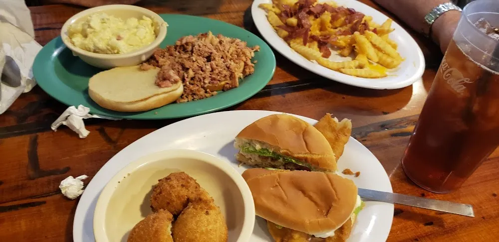Pulled Pork Sandwich w Cheesy Fries N Bacon Catfish Sandwich and Hush Puppies